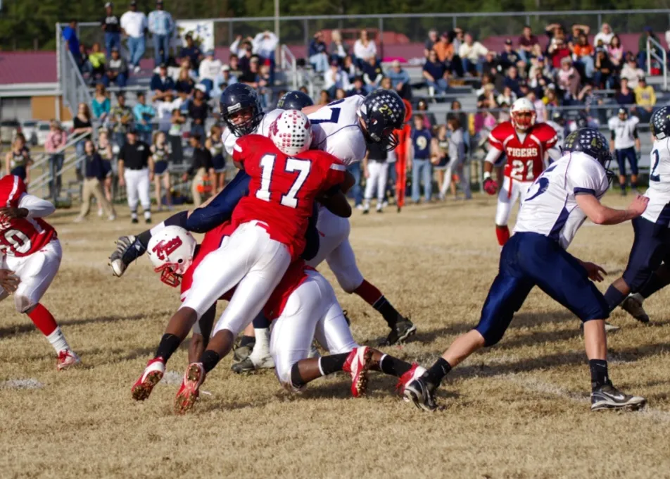 Sussex Central Tigers football game with fans cheering