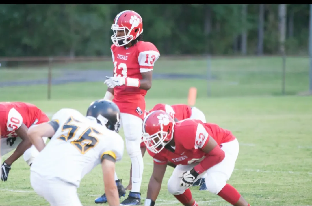 Sussex Central Tigers quarterback at the line of scrimmage