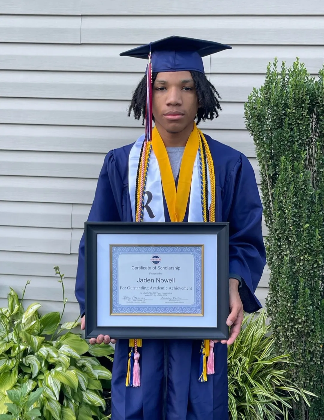 Sussex Central scholarship recipient in cap and gown